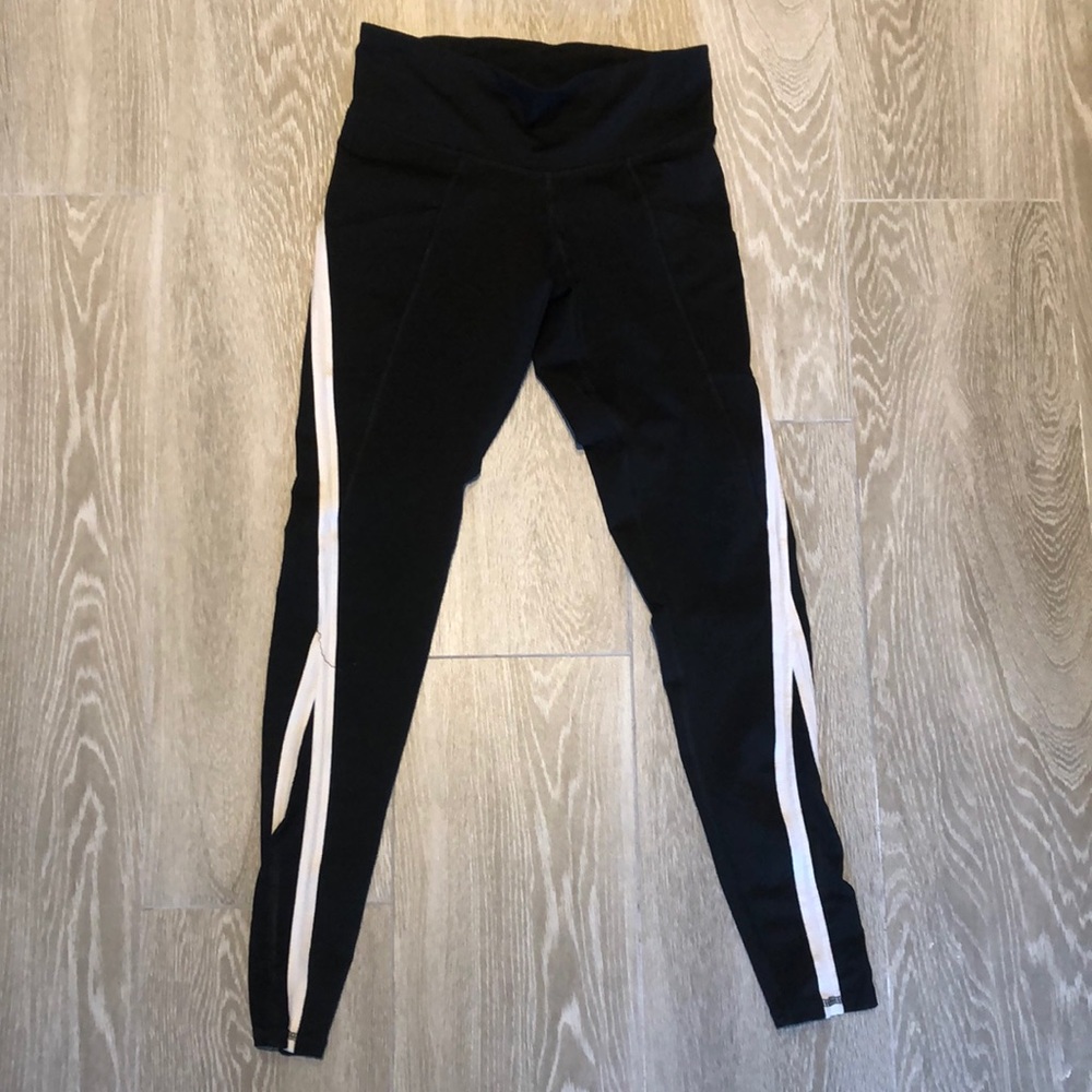 Black athletic leggings with white stripe